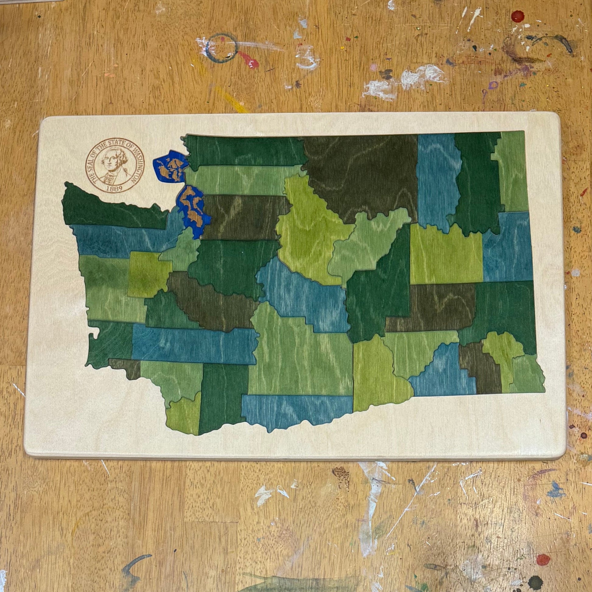 Artistic wooden map of Washington state.