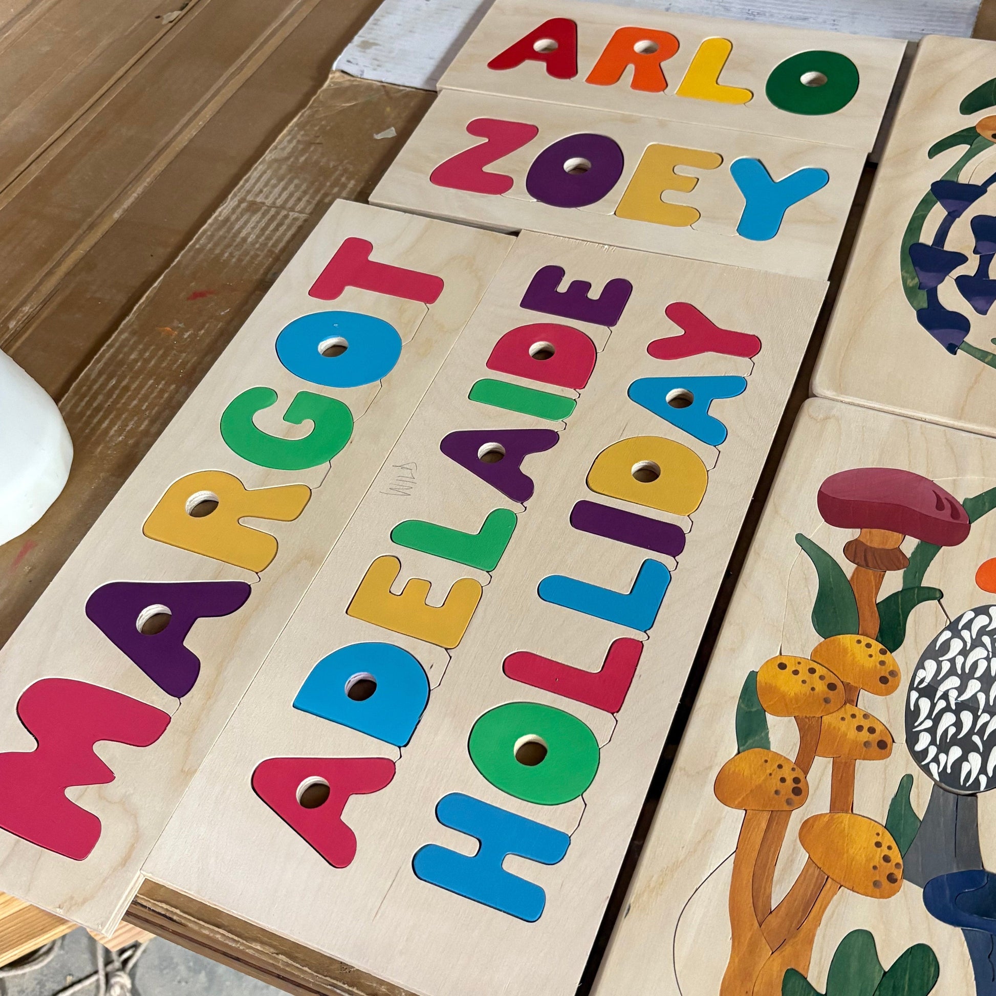 Wooden puzzle with colorful letters and images.