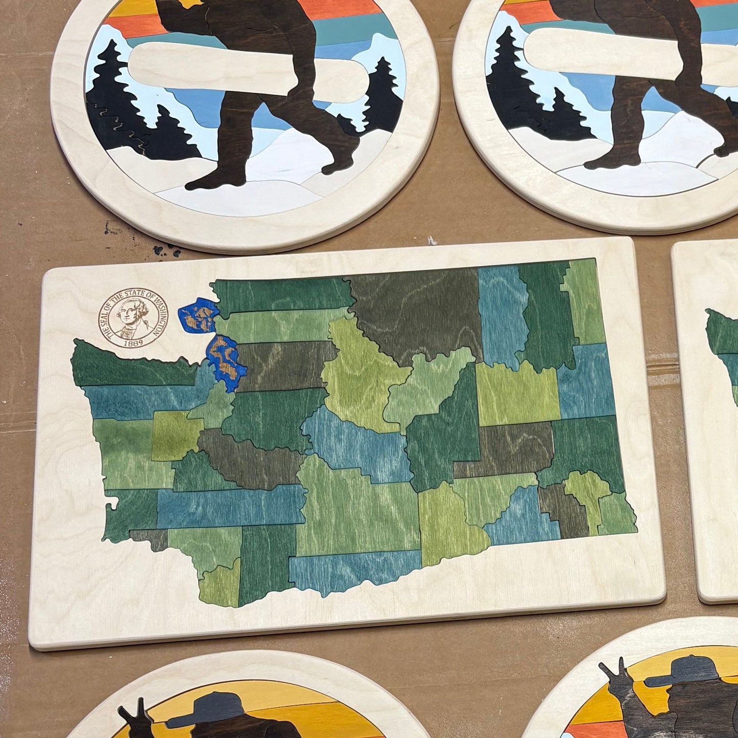 Wooden map of Washington and Snowboard Bigfoot