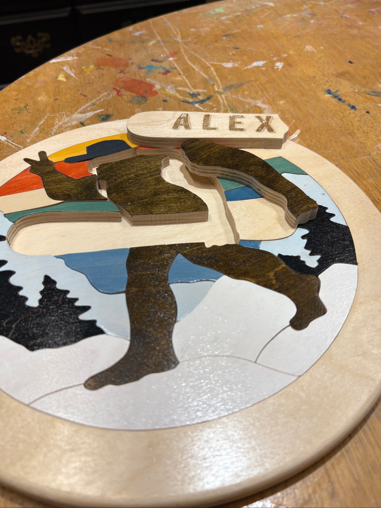 Decorative puzzle with Bigfoot design on a wooden surface