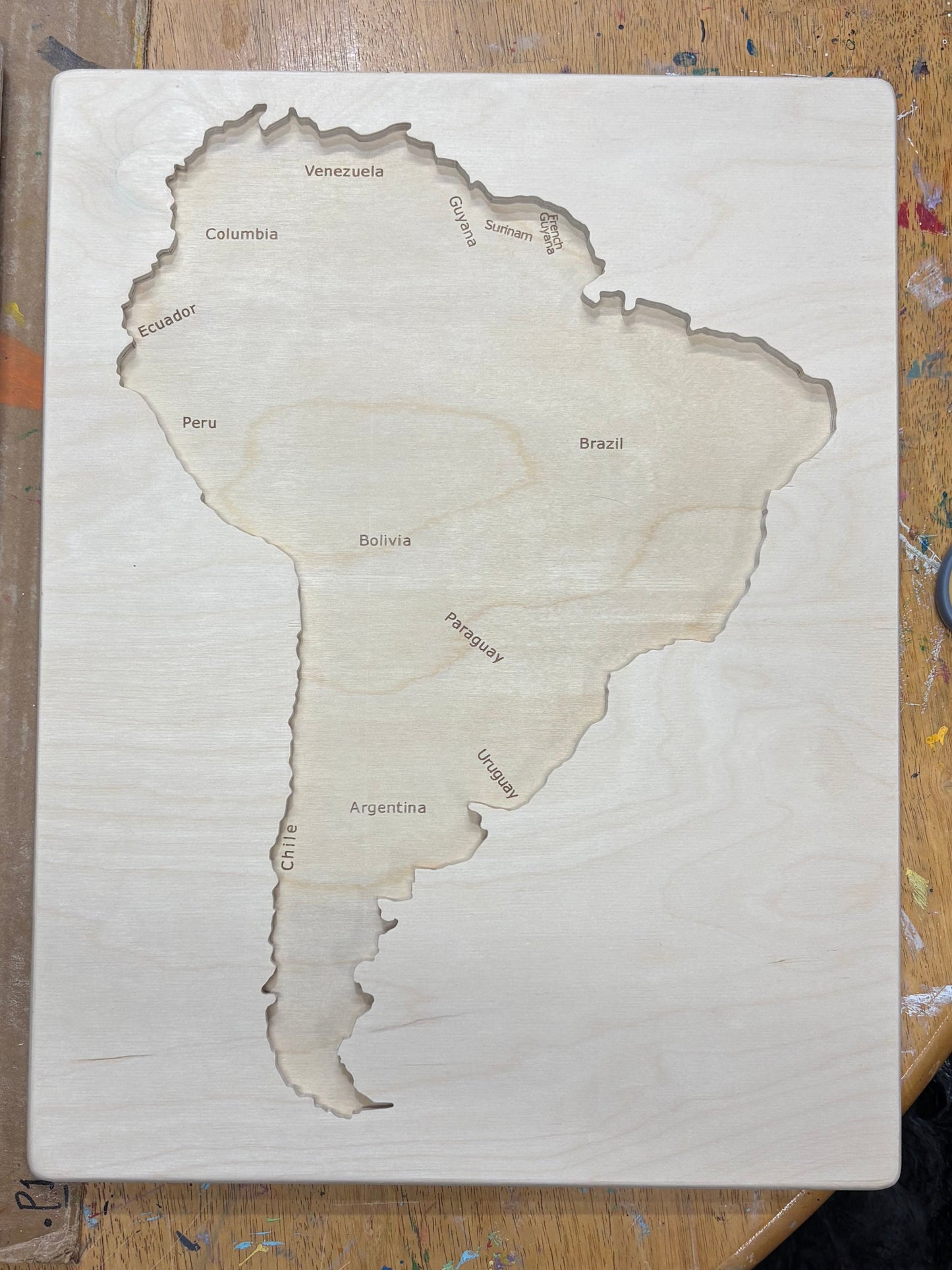Wooden puzzle  of South America Tray without pieces on wooden table