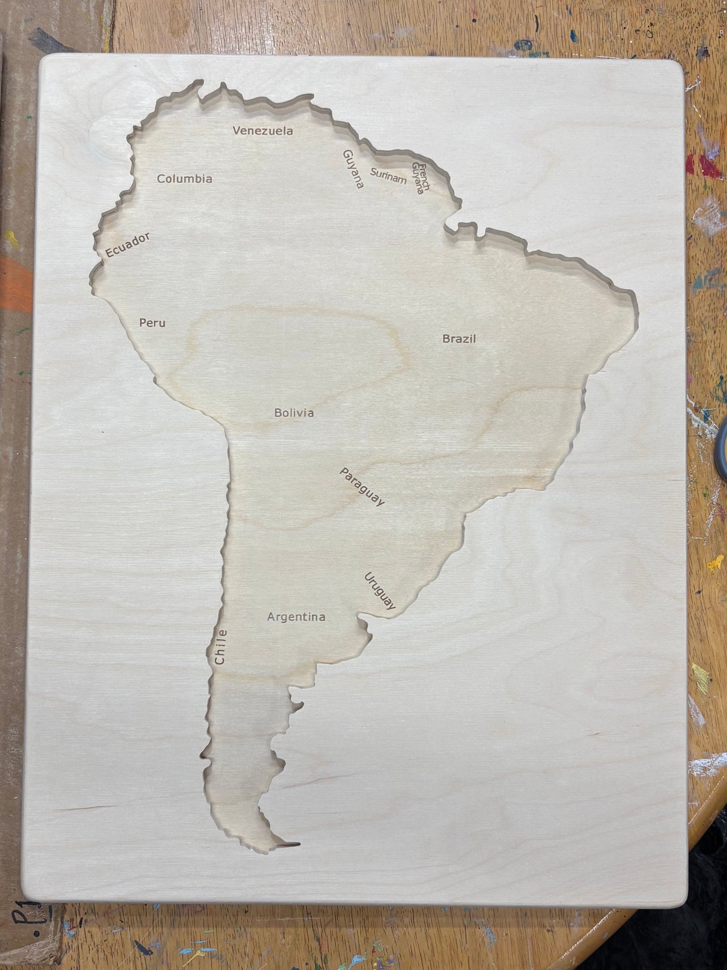 Wooden puzzle  of South America Tray without pieces on wooden table