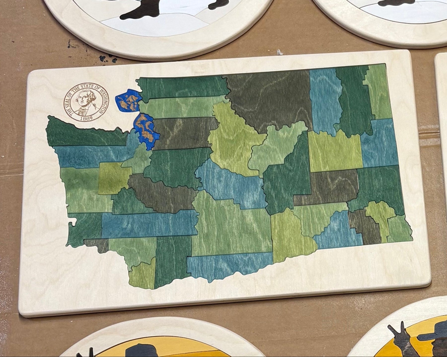 Wooden map of Washington and Snowboard Bigfoot